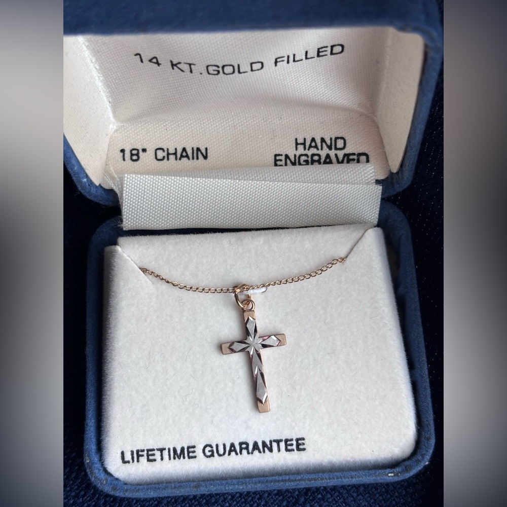 14 kt. gold filled cross necklace - never worn! 

18” inch chain
Hand engraved